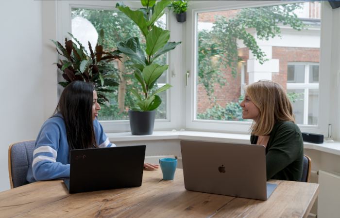 Two professionals using an account planning tool for sales team to boost efficiency